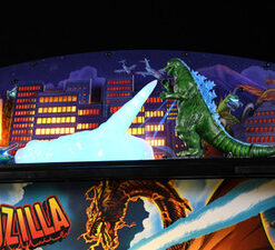 Official Godzilla Topper Accessory by Stern Pinball featuring a custom-molded Godzilla sculpture and heat ray effect